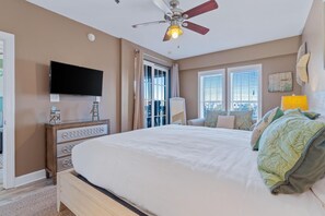 The luxury master suite includes a spacious bedroom with beautiful views of the ocean, a private entry to the balcony, a king size bed, TV/DVD, and ample closet space.