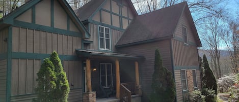 Front of house w/ small porch overlooking private yard=quiet and relaxing 