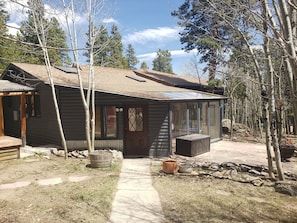 Enjoy over 2000 sq. ft. of cabin with an acre+ of peaceful surroundings.