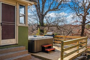 Hot tub and grill on private back deck overlooking the back yard