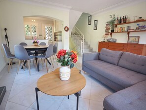 Furniture, Interior Design, Flooring, Floor, Wood, Table, Couch, Room, Living Room, Lighting