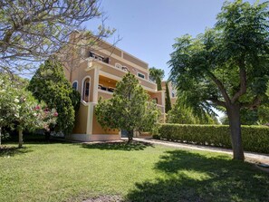 Plant, Sky, Building, Tree, Land Lot, Urban Design, Grass, Real Estate, Facade, Landscape