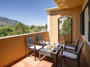 Building, Sky, Table, Furniture, Property, Window, Plant, Chair, Wood, Shade