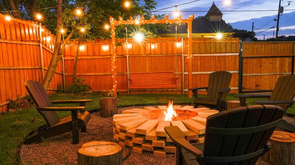 Cozy up next to the fire pit while making smores with your family or friends! 