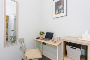 Work from the quiet of the main bedroom with fast wifi and separate desk