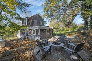The gas fireplace and seating on the private outdoor patio