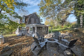The gas fireplace and seating on the private outdoor patio