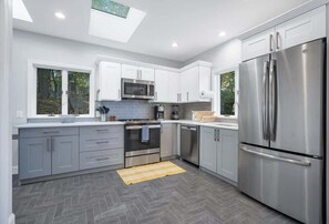The kitchen comes fully equipped with all new stainless steel appliances, coffee maker, and cooking basics.
