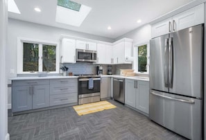 The kitchen comes fully equipped with all new stainless steel appliances, coffee maker, and cooking basics.