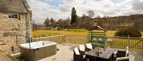 Deck area surrounded by enclosed garden