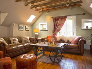 Relax in the living room at The Maltings, Nethy Bridge