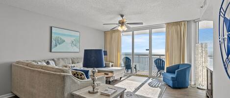 The ocean front living room is well-appointed with comfortable furnishings.