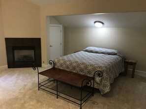 Queen bed with gas fireplace