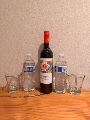 Complimentary wine & water for you to enjoy by the fire or on the rooftop deck.