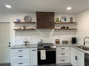 Walnut hood and live edge walnut floating shelves