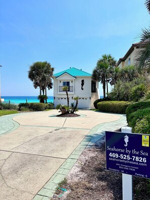 2 car garage and circle drive with a long driveway.