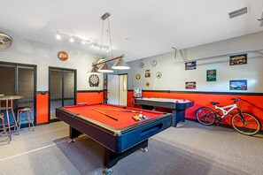 Games room with pool table and air hockey
