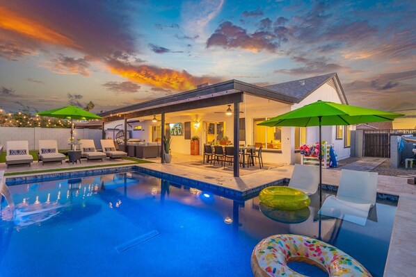 Private back yard with pool, hot tub, grill and outdoor dining.