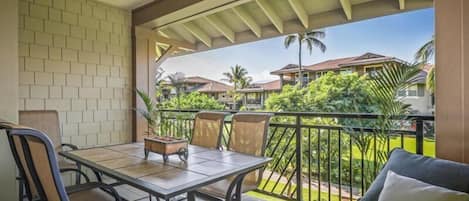 Lanai set up to enjoy a meal and serene garden views