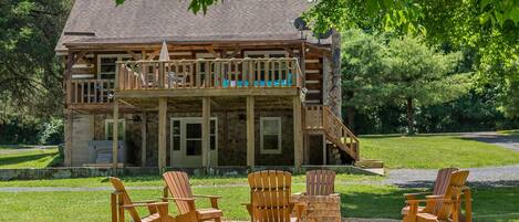 Welcome to Lazy Bear Lodge--this gorgeous log cabin, situated on a flat riverfront lot with firepit, hot tub, endless outdoor fun!