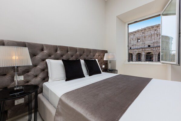 The apartment overlooks the Colosseum, which is visible from all the windows. 