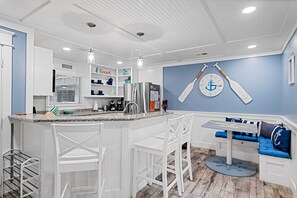 Dining space with additional seating at the counter height bar