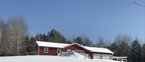 View of house in winter.   