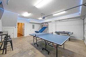 Hang out and team up in the converted game room.