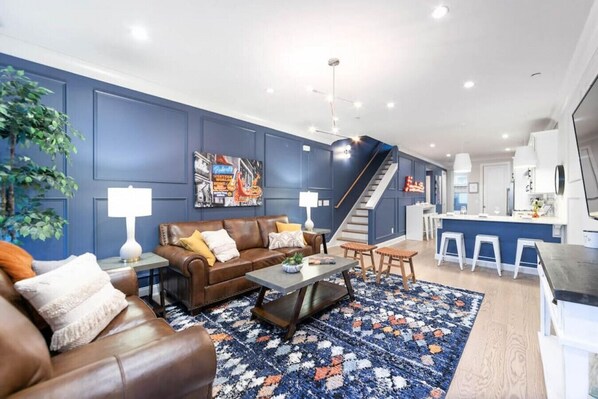 Spacious living room with mounted flat screen tv.