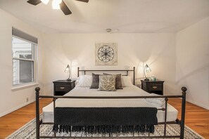 Experience the best of suburbia in this lovely master bedroom with private ensuite bath fitted with a vintage clawfoot soaking tub.