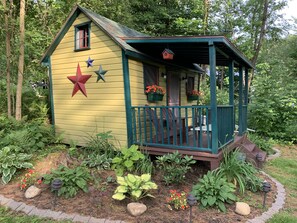 Single bed cottage in back of main camp