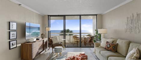 Main living area with balcony and Gulf front, ocean views with stunning sunsets