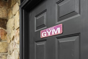 Gym door located to right of front door 