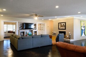The open concept living room and dining room make the house seem like it goes on forever