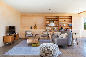 Midcentury Modern furniture completes the living area.