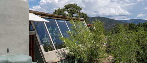 An outside view of the Cielo Alto Casita rental with the mountains and big sky.