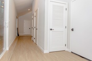 Entry hall includes large custom coat closet and full-size washer/dryer.