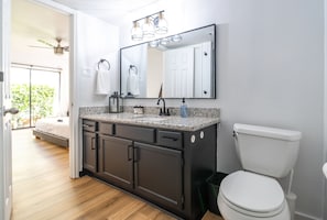 This newly renovated full bathroom connects to the primary bedroom.