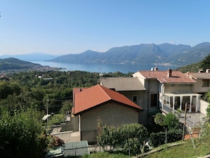 Sky, Plant, Property, Water, Mountain, Building, Tree, Highland, Natural Landscape, Land Lot