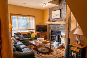 Cozy family room with wood burning fireplace