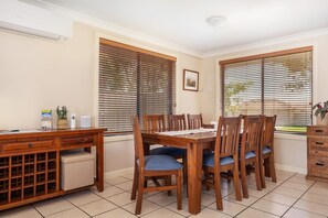 The dining table seats eight making meals at home easy.