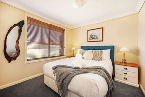 A third bedroom comes with a queen size bed, portable fan and window blinds.