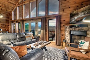 Great Room with plenty of comfy seating, gas fireplace and large screen TV. 