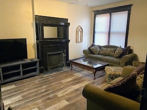 Living room with large flat screen tv