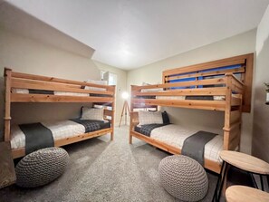 Double bunk beds!  Slide open suitcases under the beds, dresser in the closet