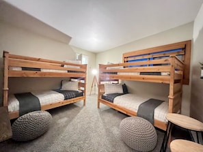 Double bunk beds!  Slide open suitcases under the beds, dresser in the closet
