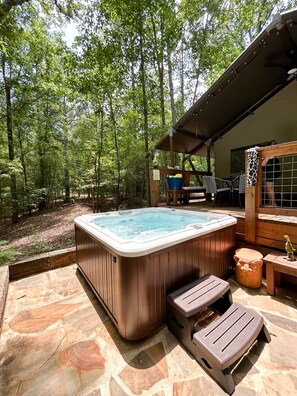 The Hot Tub provides access from the stone patio or deck.  
