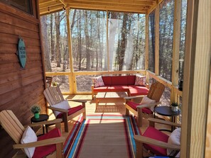 Amazing seating abounds on the screened in porch!