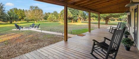 Relax on the front porch overlooking the beautiful pond and wildlife