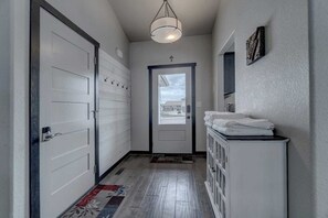 Entry way with key code controlled front and garage door
